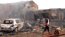 Sprogimo padariniai Džoso turgavietėje, Nigerijoje.