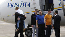 Į Ukrainą sugrįžę politiniai kaliniai