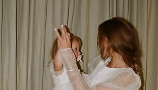 Monikos Kazakevičiūtės-Kri&scaron;čiūnienės ir Jono Kri&scaron;čiūno dukros Umos krik&scaron;tynų akimirka