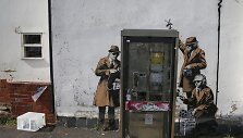 Grafitis prie Didžiosios Britanijos žvalgybos agentūros GCHQ būstinės