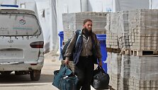 Sirijoje i&scaron; Rytų Gutos evakuoti kovotojai bei jų &scaron;eimos nariai