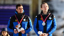 Vitalijus Tru&scaron;as (kairėje, M.Mura&scaron;kovskio vedlys) Maksimas Mura&scaron;kovskis (de&scaron;inėje)