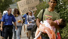 Migrantai &Scaron;veicarijoje
