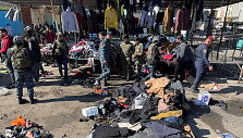 Bagdado centre nugriaudėjus dviem sprogimams žuvo mažiausiai 13 žmonių