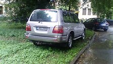 Fotopolicija. Visureigis ant žolės.