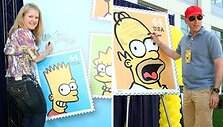 JAV pa&scaron;to ženklus papuo&scaron; Simpsonų atvaizdai. 