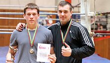 Ovidijus Auk&scaron;tkalnis su savo treneriu Giedriumi Vai&scaron;toru