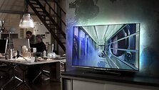 Plok&scaron;čiaekranis televizorius su ekrano ap&scaron;vietimo funkcija &bdquo;Ambilight&ldquo;