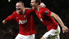 Wayne'as Rooney ir Jonny Evansas