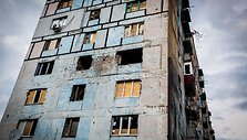 Artilerijos sviediniais ap&scaron;audytas daugiabutis
