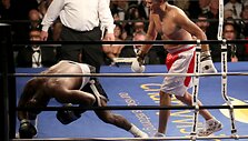 Evanderio Holyfieldo ir Mitto Romney kova