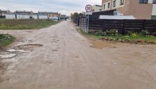 Už sąvartos zonos esančios Romaini&scaron;kių gatvės ir jos &scaron;alutinių gatvių būklė