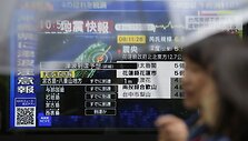 Eugene Hoshiko / AP