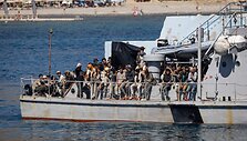 Migrantai / COSTAS METAXAKIS / AFP