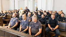 Ginkluotą moterį nu&scaron;ovusio pareigūno teismo posėdis