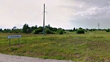 Miestelio, kuriame gyvena 480 žmonių, pradžią žymintis kelio ženklas.