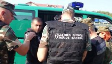 Lietuvos pasieniečiai kolegoms i&scaron; Lenkijos perdavė a&scaron;tuonis migrantus i&scaron; Irako