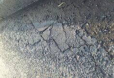 Ašigalio gatvės defektai po remonto