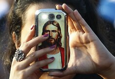 Mobilusis telefonas su Jėzaus Kristaus atvaizdu.