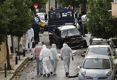 Tyrėjai sprogimo vietoje