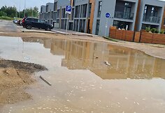 &bdquo;&Scaron;iaurės pa&scaron;vaistės&ldquo; kvartalo gyventojai po liūčių sunkiai pasiekia savo namus.