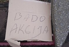 Plakatas apie bado akciją