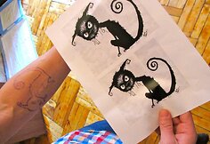 Olego iš „Biplan“ tatuiruotė