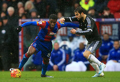 Wilfriedas Zaha ir Cescas Fabregasas