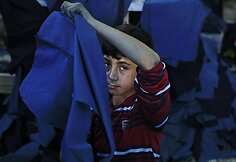 Pabėgėliai i&scaron; Sirijos ir jų vaikai dirba Turkijos gamykloje