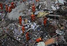 Kinijoje sugriuvę pastatai