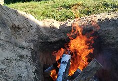 Archainiu būdu duobėje kepama mėsa