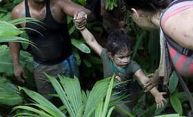 Kubiečių migrantų kelionė į Panamą per Kolumbijos džiungles