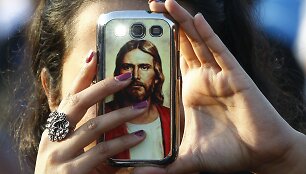 Mobilusis telefonas su Jėzaus Kristaus atvaizdu.