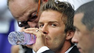 Davidas Beckhamas su sūnumi Brooklynu stebi dvikovą tarp ispano Rafaelio Nadalio ir brito Andy Murray'aus.