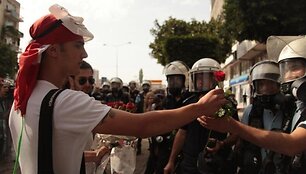Protestors giving policemen flowers