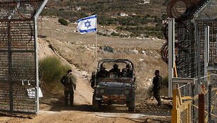 Izraelio karinės transporto priemonės Sirijoje / JALAA MAREY / AFP