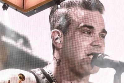 Robbie Williamso koncerto akimirka