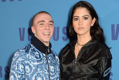 Rocco Ritchie ir Kim Turnbull atvyko į "Versace" kolekcijos pristatymą