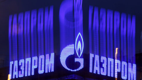 The company logo of Russian natural gas producer Gazprom is seen on an advertisement installed on the roof of a building in St. Petersburg in this November 14, 2013 file photo. As bankers, traders and investors gathered at Gazprom's London offices for its annual champagne reception, the message from