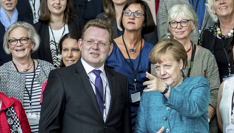 Andreas Hollsteinas ir Angela Merkel