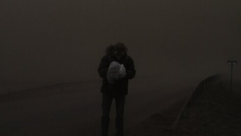 Fotografas mai&scaron;elyje įsidėjęs fotoaparatą