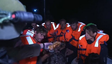 Pagalbos grupės nariai / - / AFP