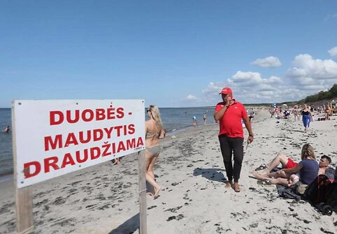 Įspėjamieji ženklai pajūryje 