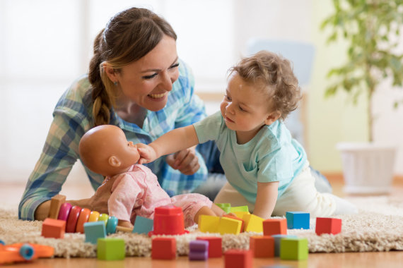 Photo from 123RF.com / Child playing with doll