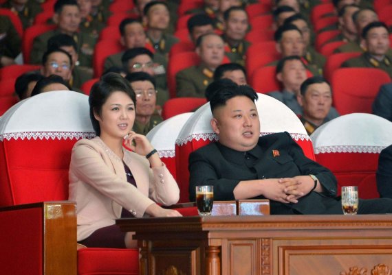 AFP / Scanpix Photo / Kim Jong Un with his wife Ri Sol-ju