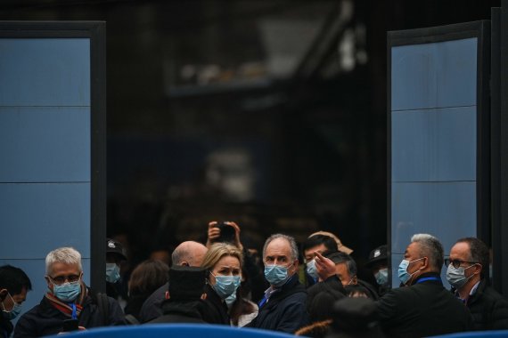 AFP / Scanpix Photo / Experts from the World Health Organization at Juan Market