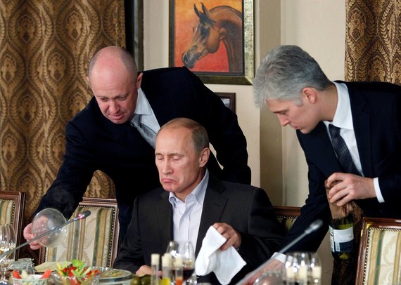 Reuters / Photo by Scanpix / J.Prigožinas with V. Putin and D.Peskov
