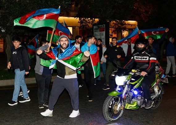 AFP / Scanpix photo / Triumphant Azerbaijanis on the streets of Baku