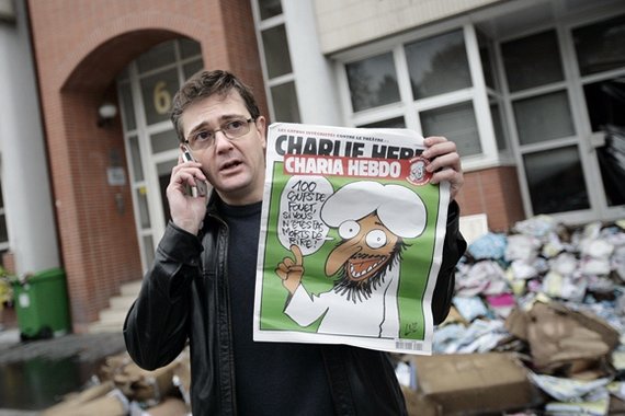 AFP/„Scanpix“ nuotr./Charbas laiko 2011 m. lapkričio 2-osios „Charlie Hebdo“ žurnalą.