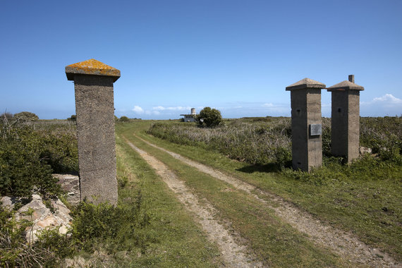 Photo by Vida Press / Only a few pillars of the old gates of the concentration camp remain.